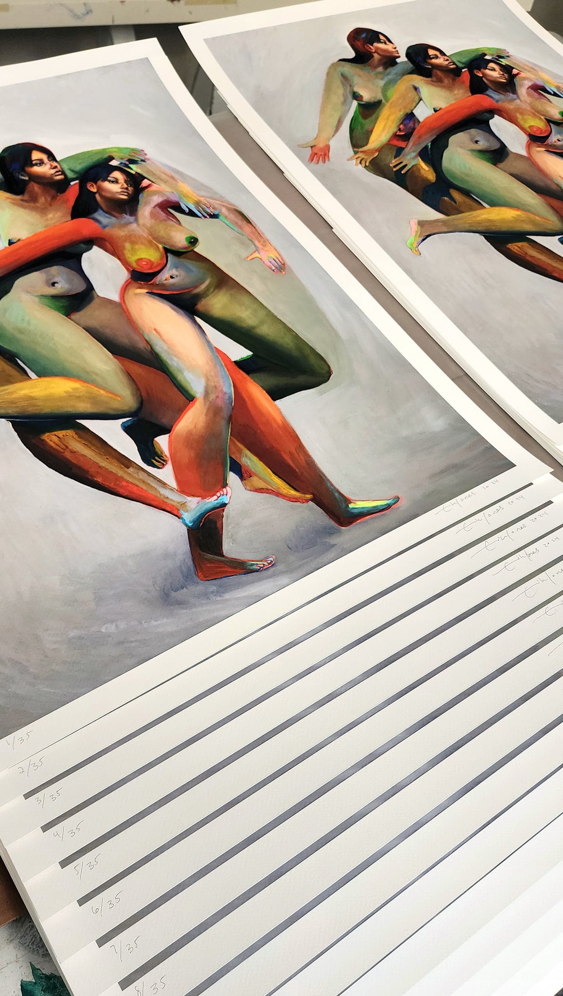 Erik Jones print of three nude figures with the same face and colorful bodies  - print stacked on top of each other