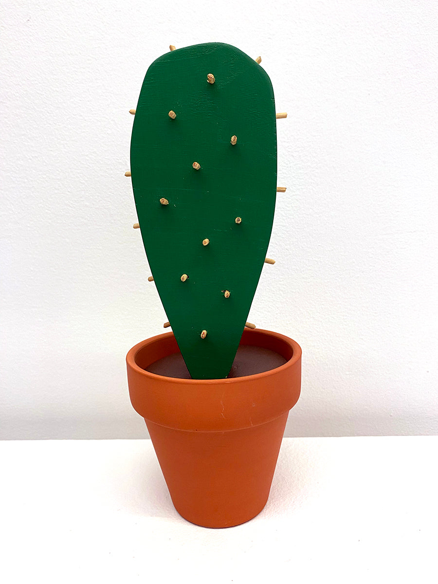 wooden sculpture of a cactus in terracotta pot