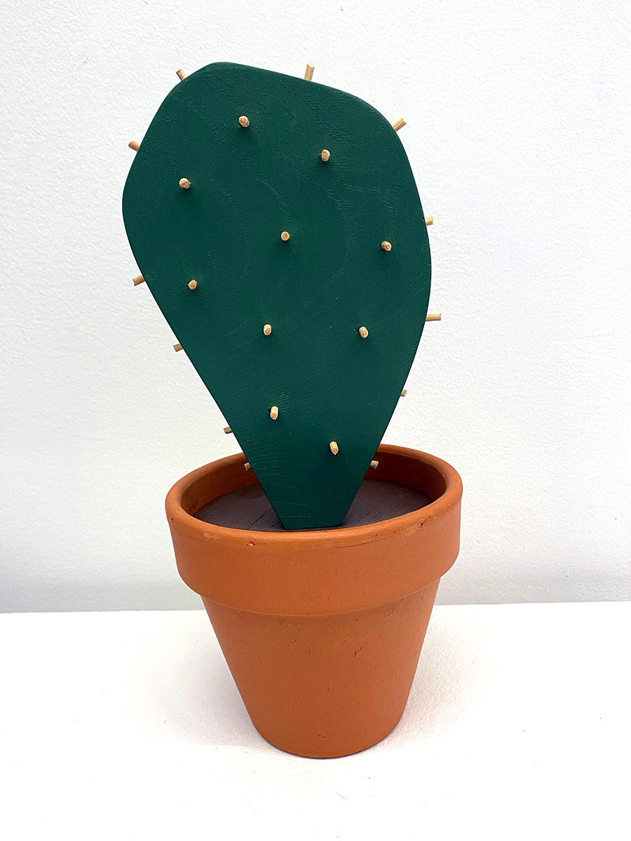 Wooden sculpture of a cactus in terracotta pot 