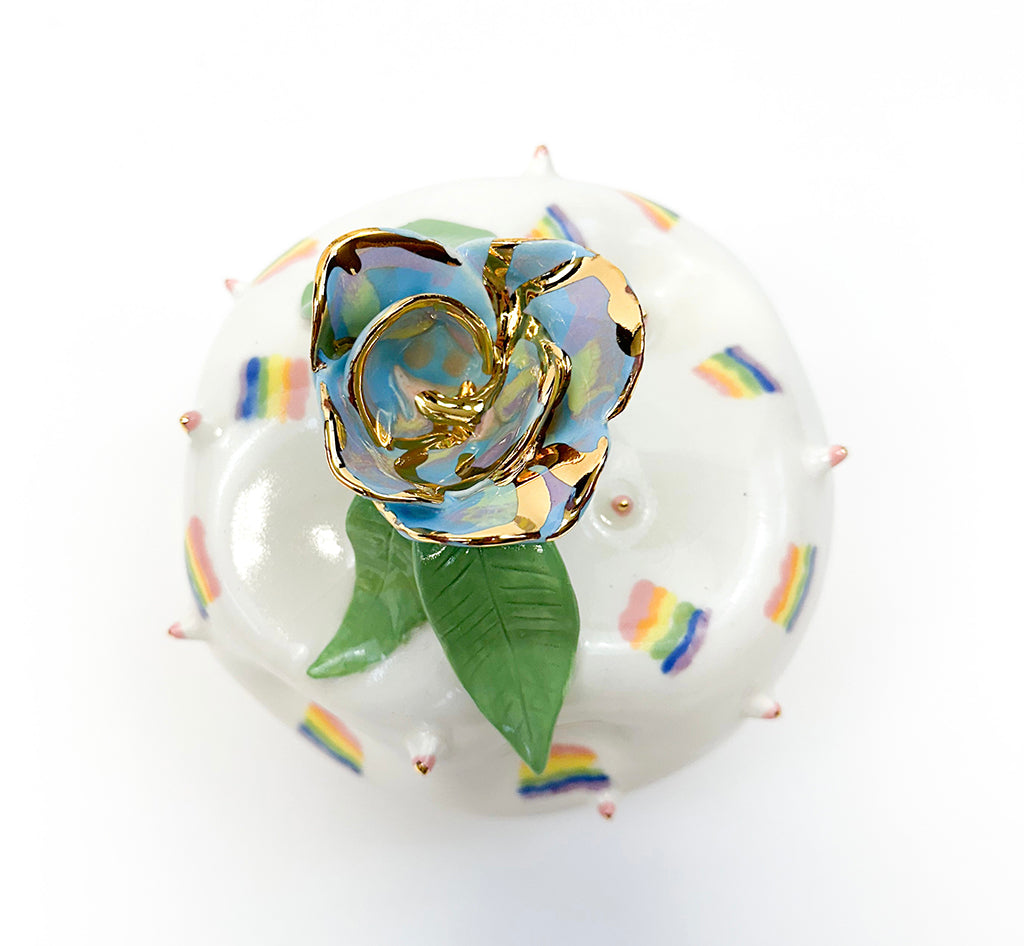 Photo of a ceramic sculpture with rainbows and a gilded finish by Jen Dwyer